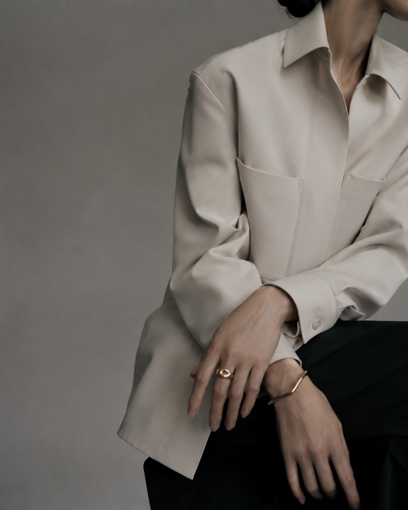 Hands working on garment details